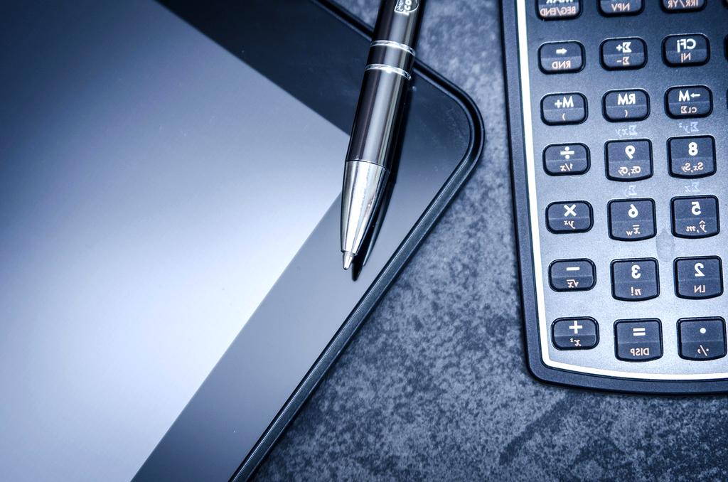 Close up of a retirement planning calculator and pen
